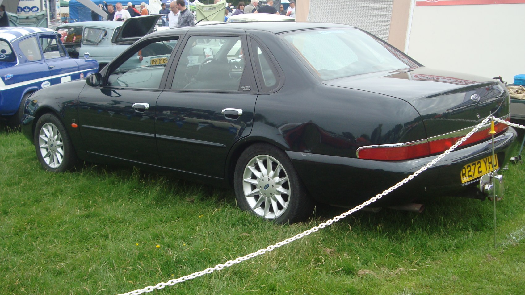 Rear side profile of a black sedan with alloy wheels