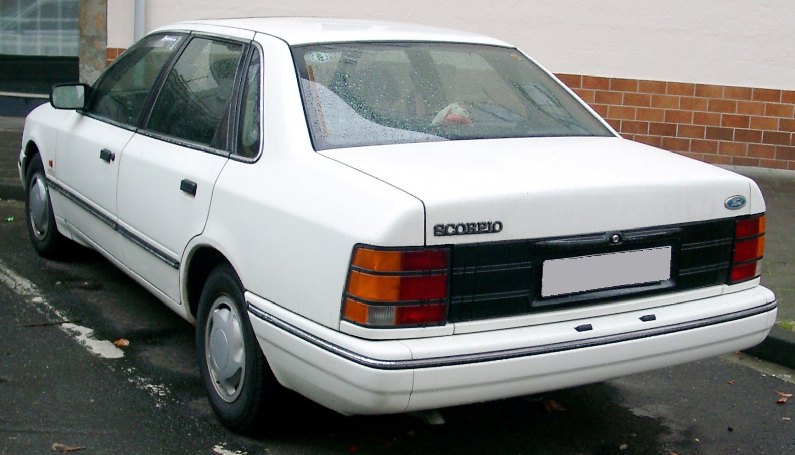 Classic sedan rear view with distinctive taillights and boxy 1980s design.