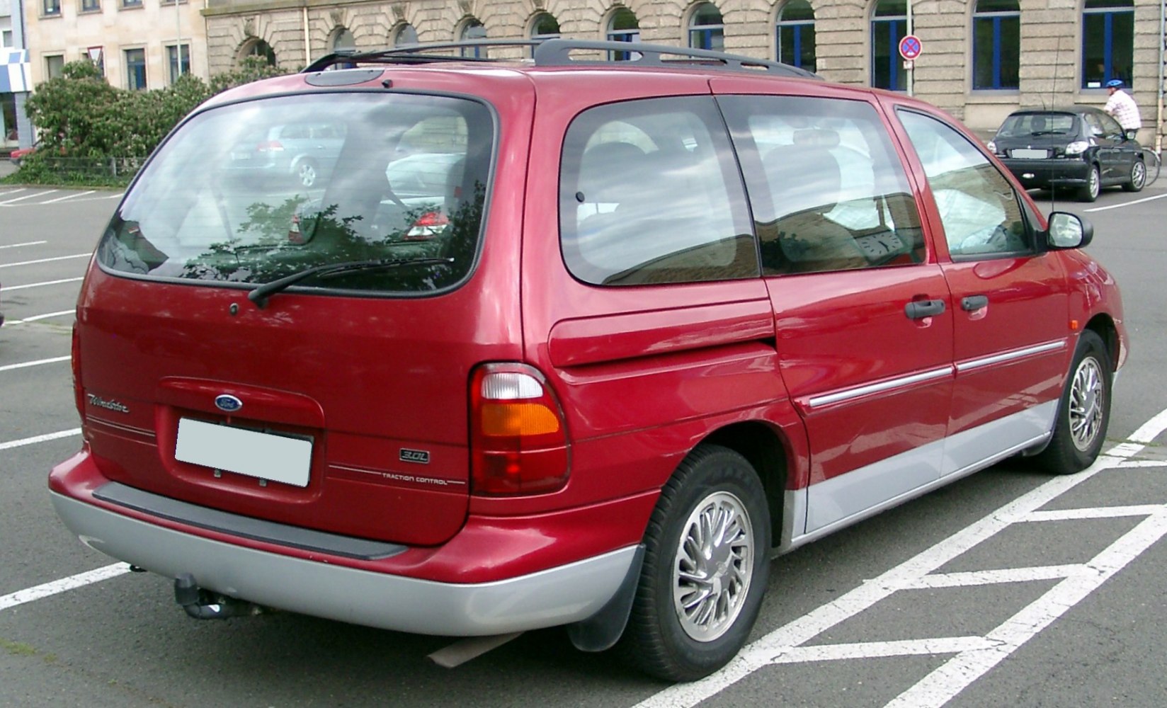Large rear window and taillight of a 1998 minivan