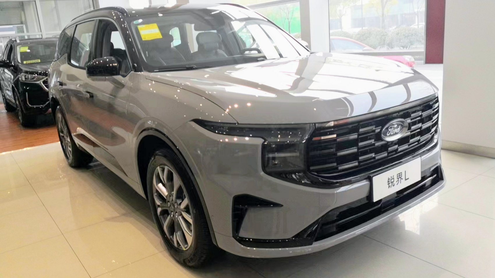 Sleek front grille and LED headlights on a modern SUV.