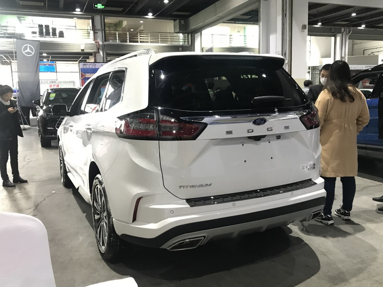 Rear view of modern SUV featuring sleek taillights and sporty bumper