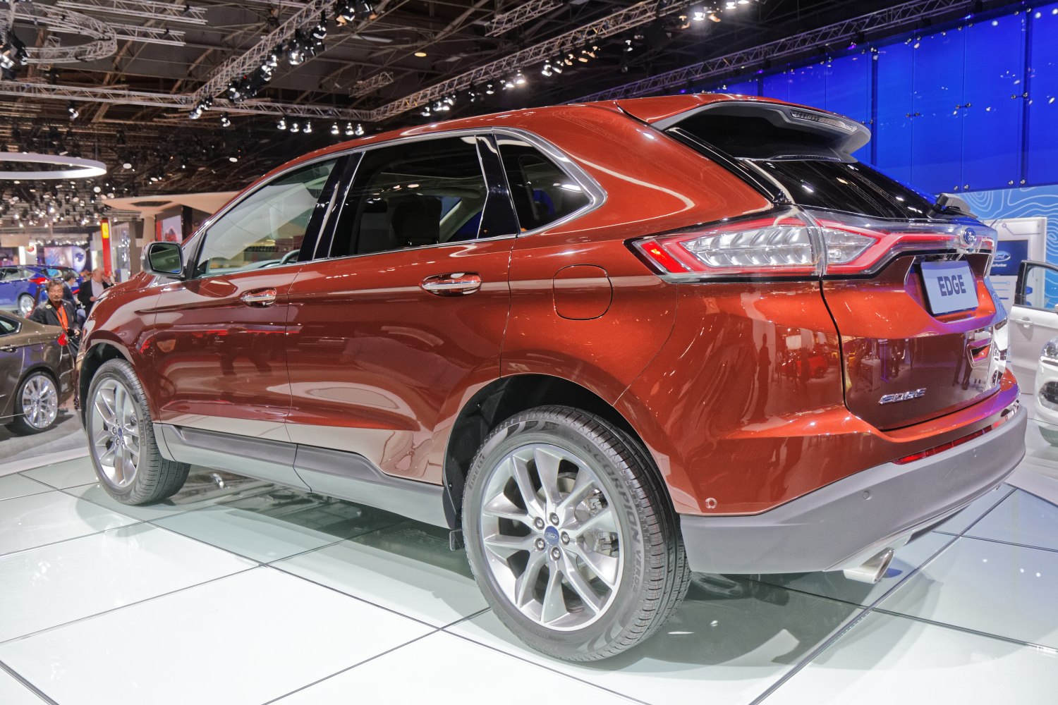 Rear side view of SUV with alloy wheels and sharp taillights.