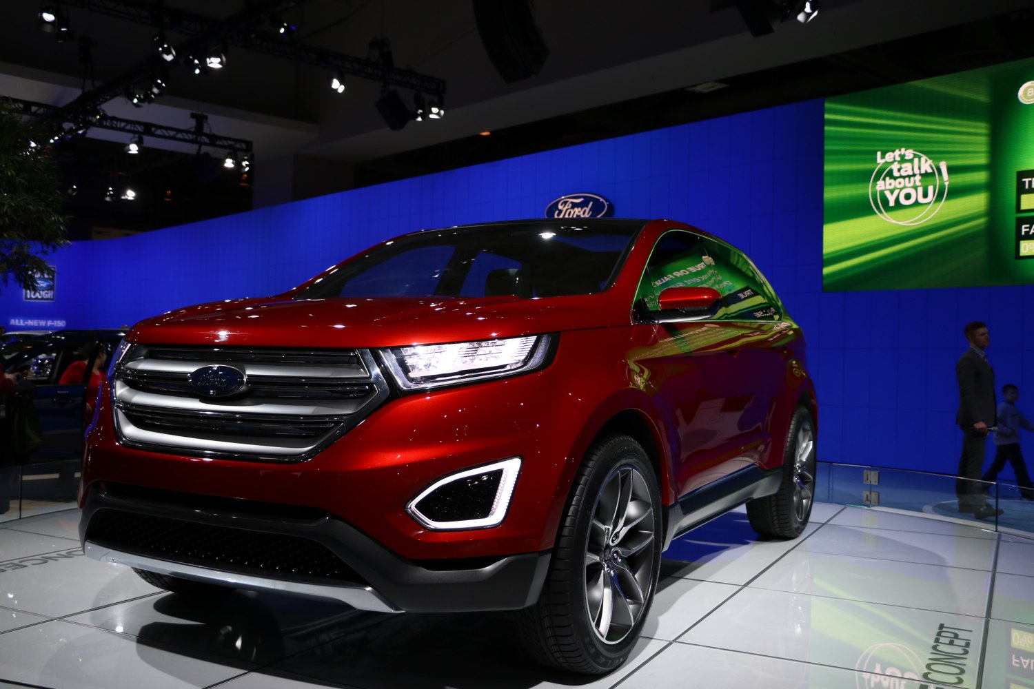 Red SUV front with LED headlights and bold grille design