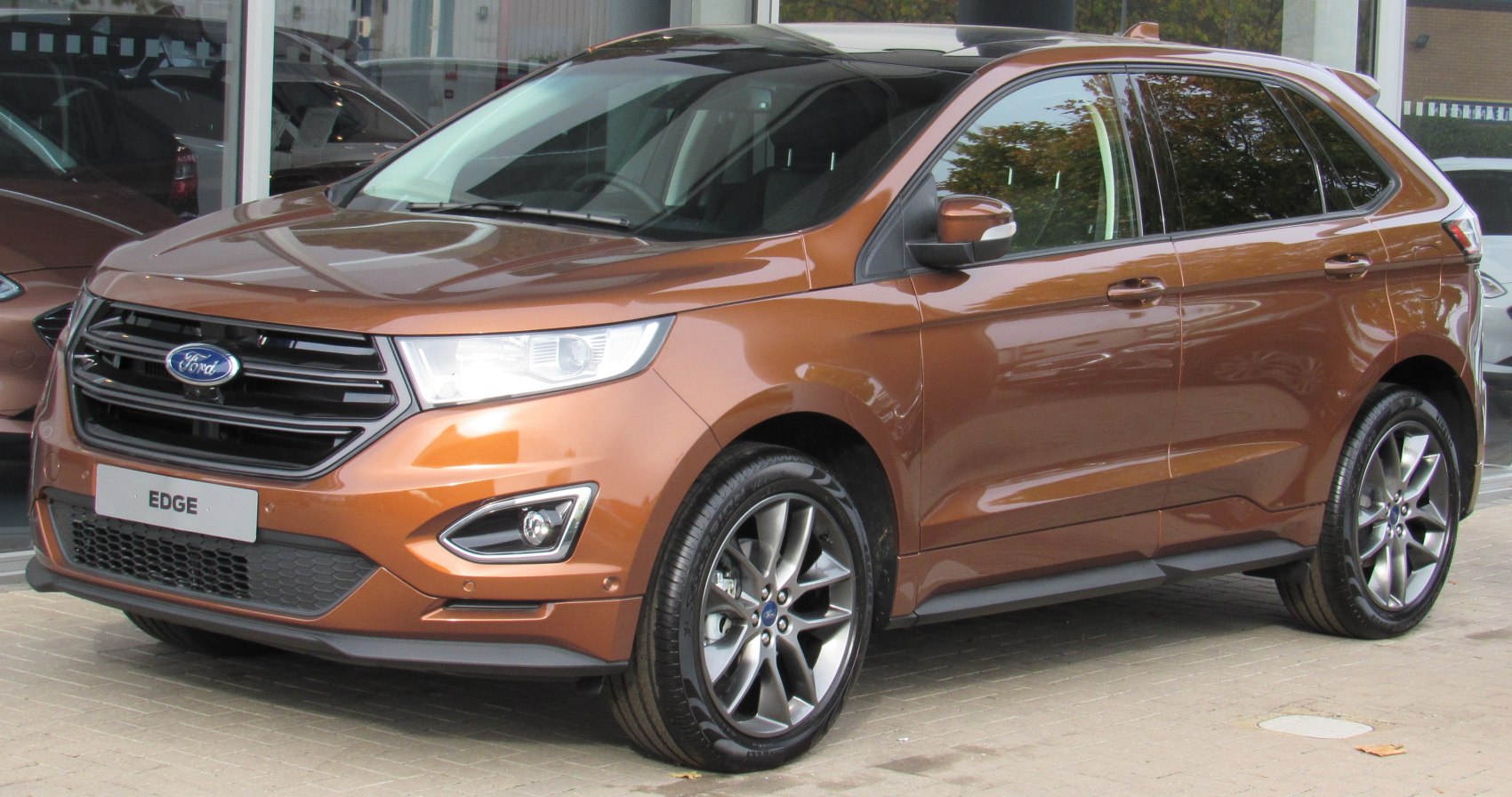 SUV with alloy wheels and modern headlights front side view