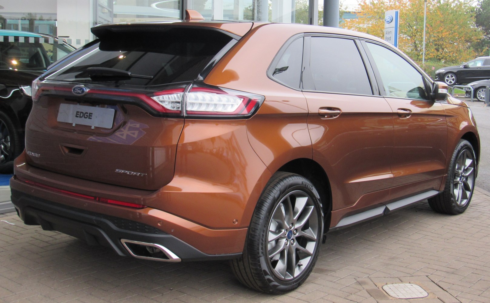 Rear and side view of SUV with Sport trim and alloy wheels