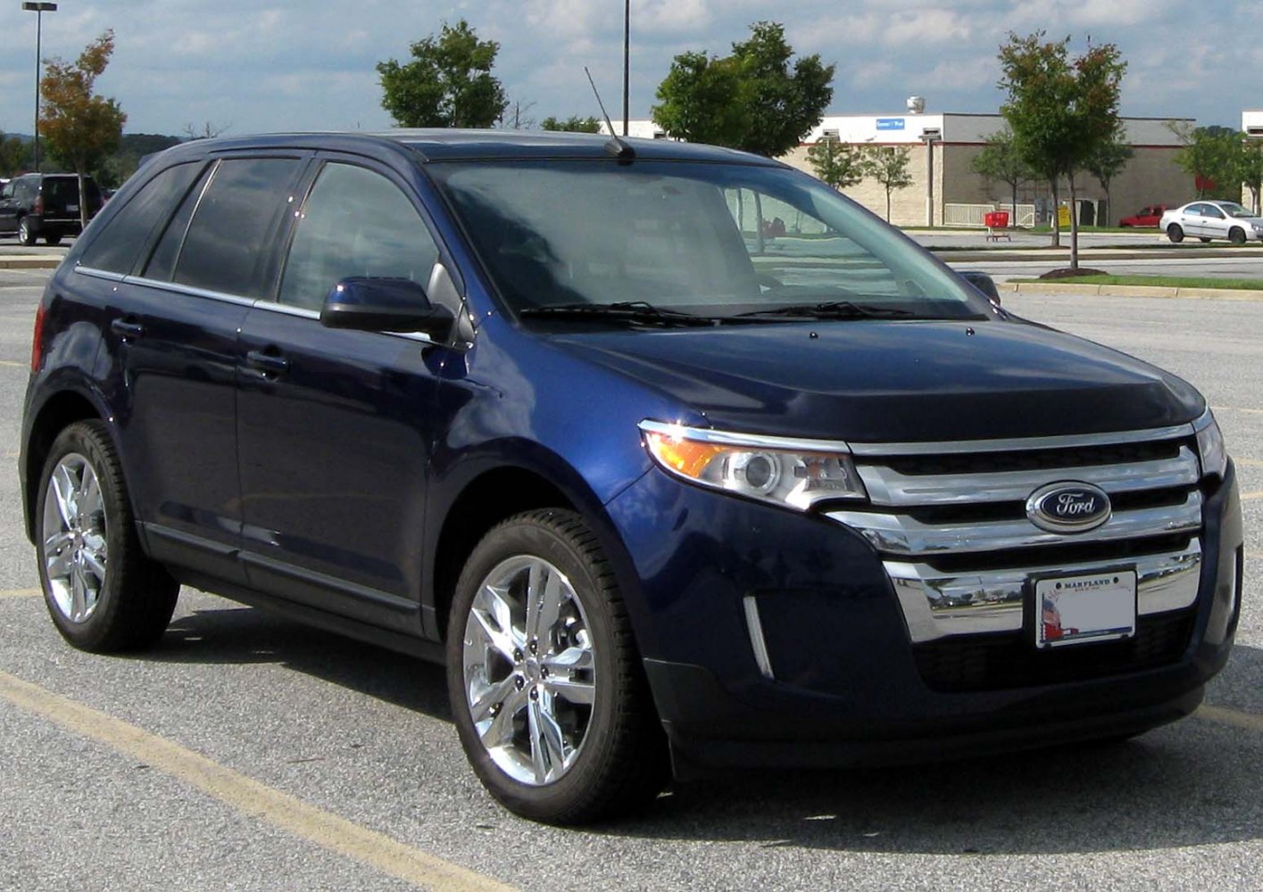 Front side angle with chrome grille and alloy wheels
