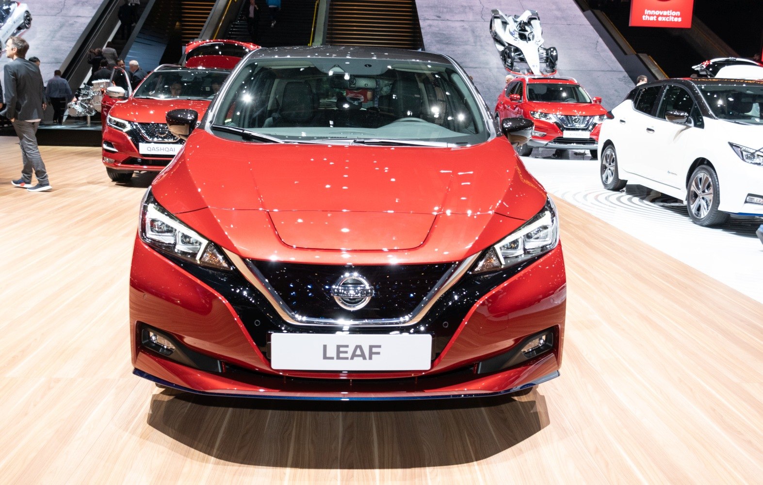 Front view of a modern electric hatchback with LED headlights and sleek grille