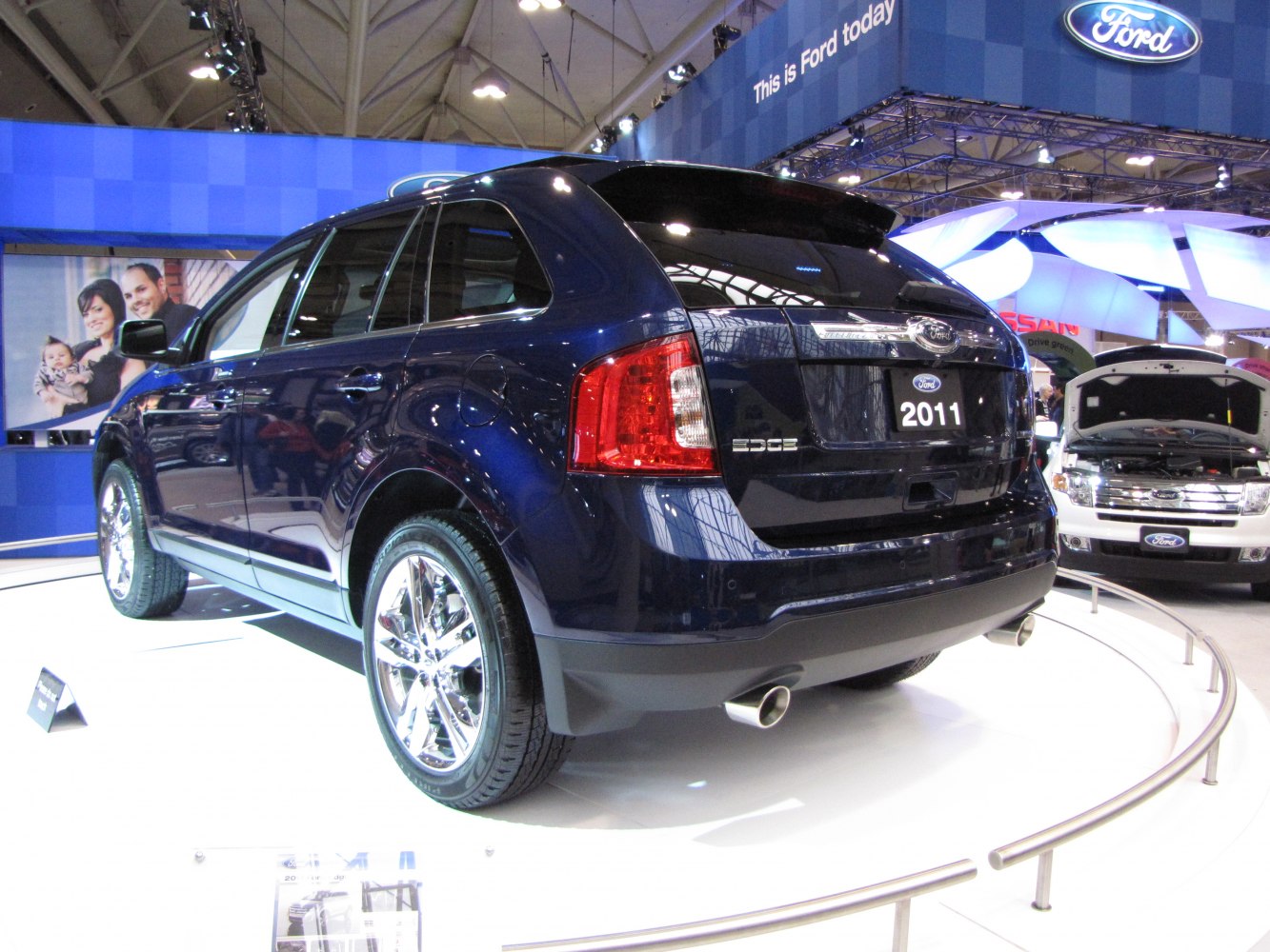 Rear side view with chrome wheels and dual exhausts