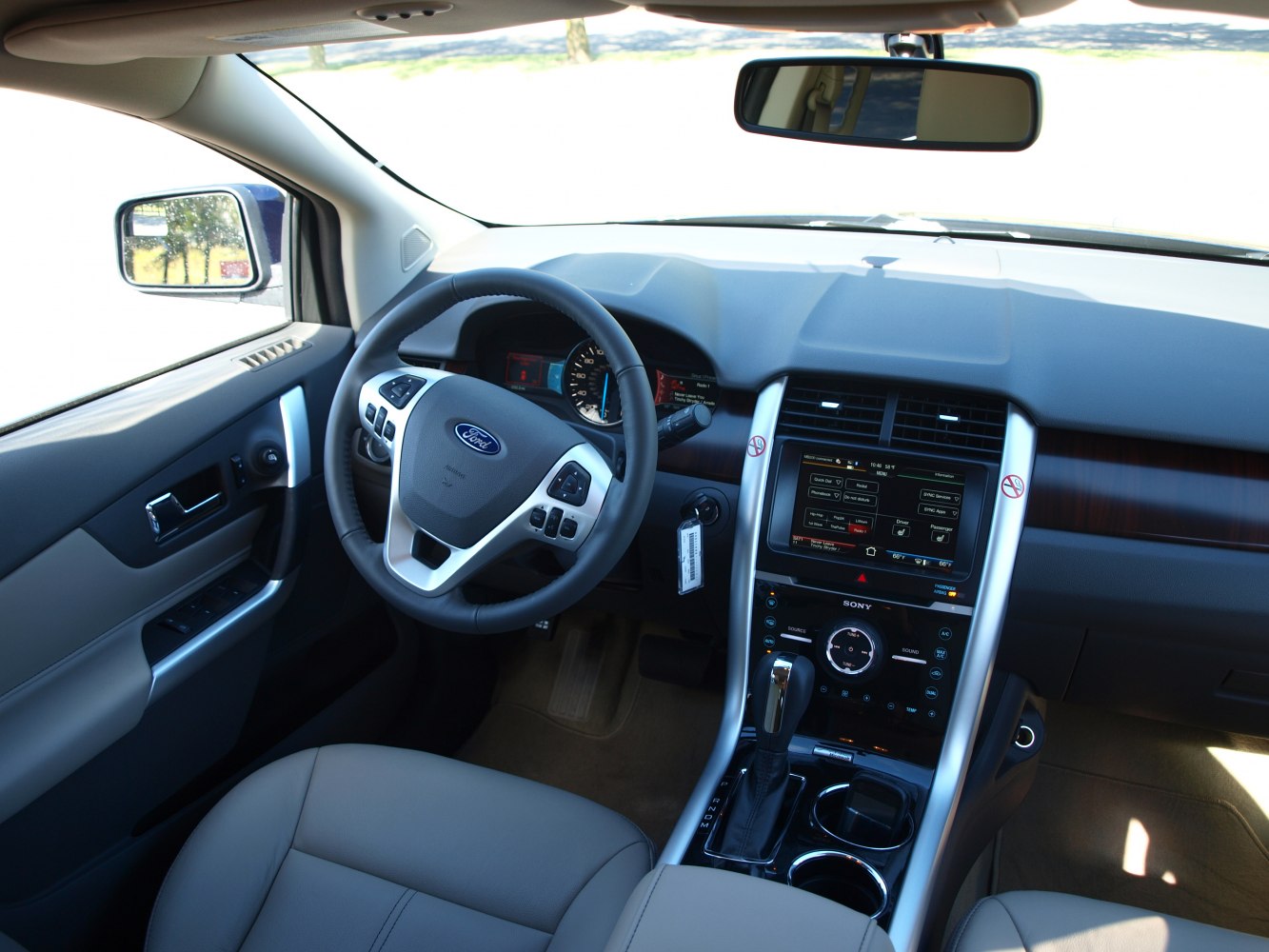 Interior view of steering wheel and touchscreen dashboard