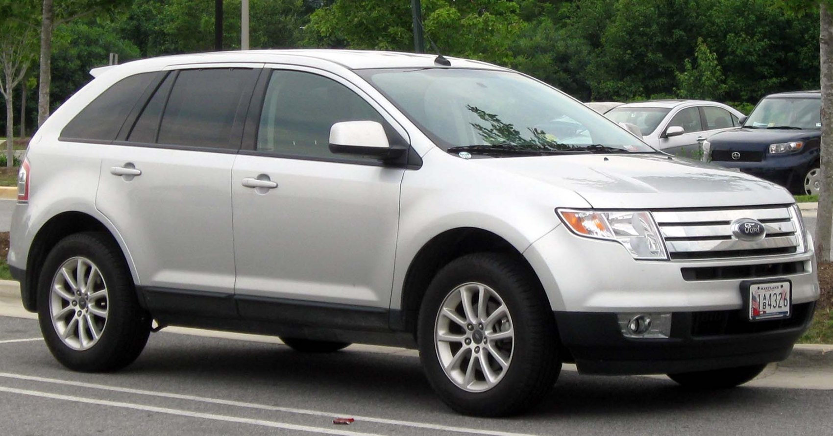 Silver SUV front side view with alloy wheels