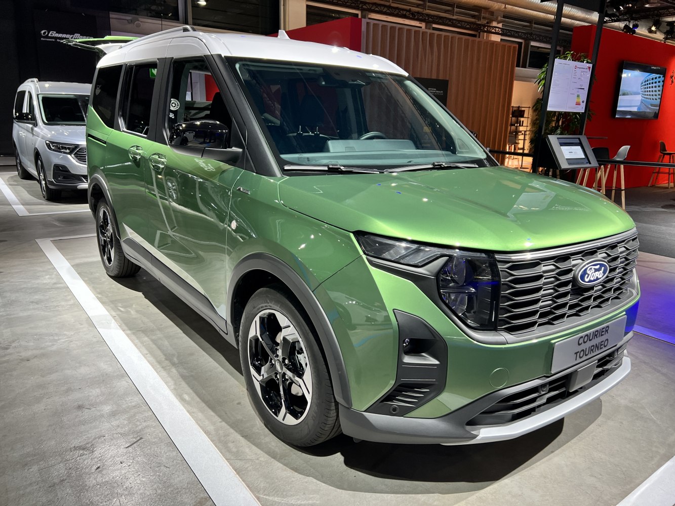 Front and side view of a compact MPV with modern headlights and large grille