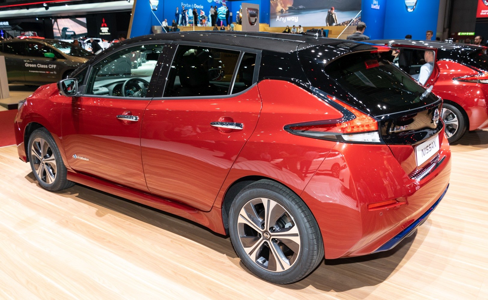 Rear and side view of an electric hatchback with two-tone paint and stylish wheels