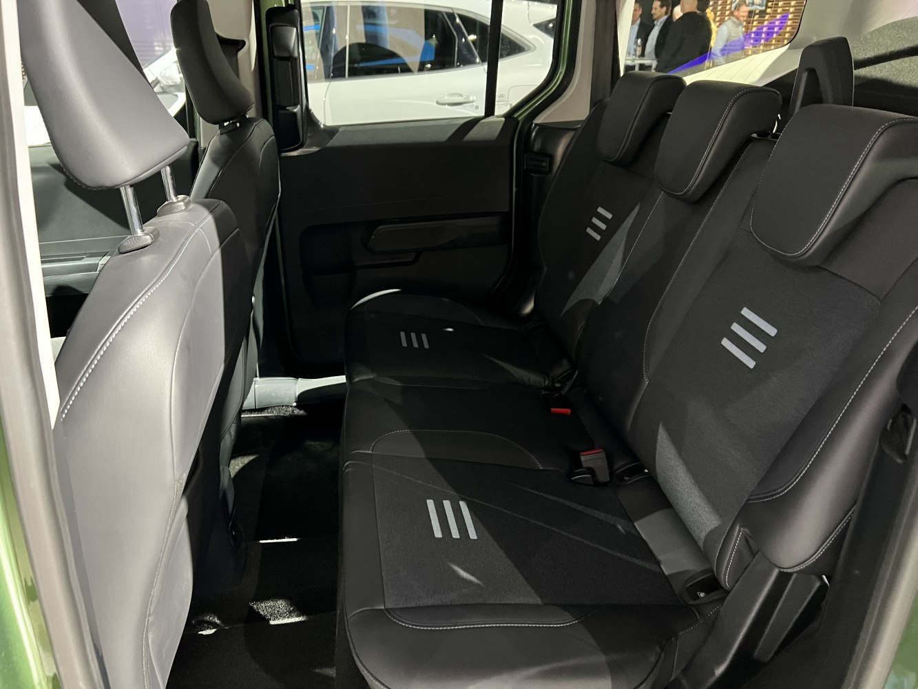 Rear interior seating with black upholstery and headrests