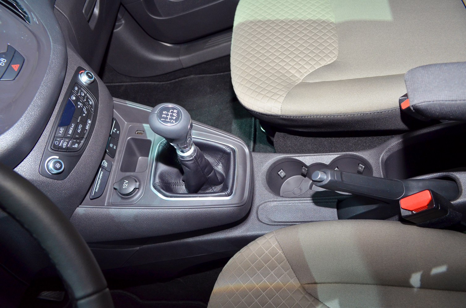 Manual gear shifter, climate control panel, and patterned seating fabric