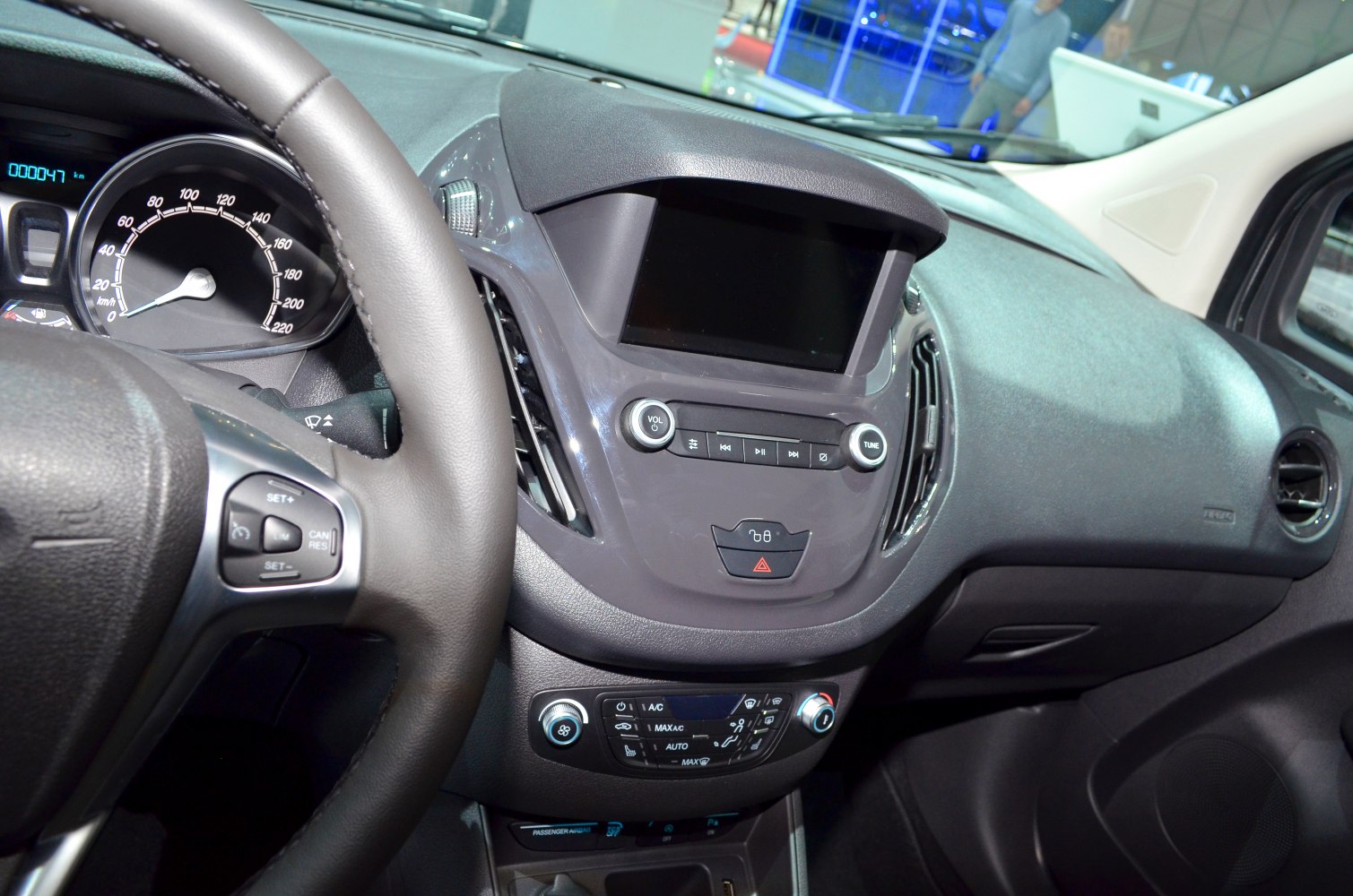 Dashboard with touchscreen, steering wheel controls, instrument panel