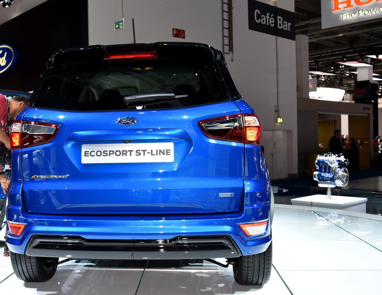 Rear view of blue SUV with modern tail lights and bumper design