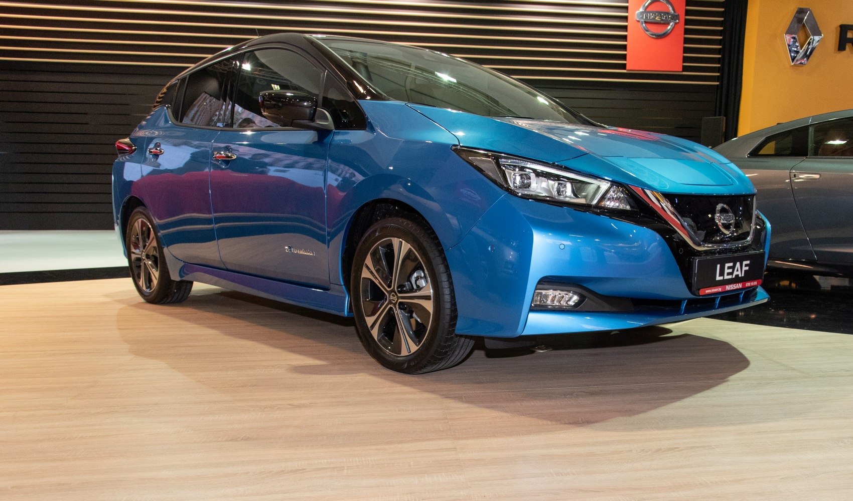 Electric hatchback front side view with aerodynamic design and LED headlights