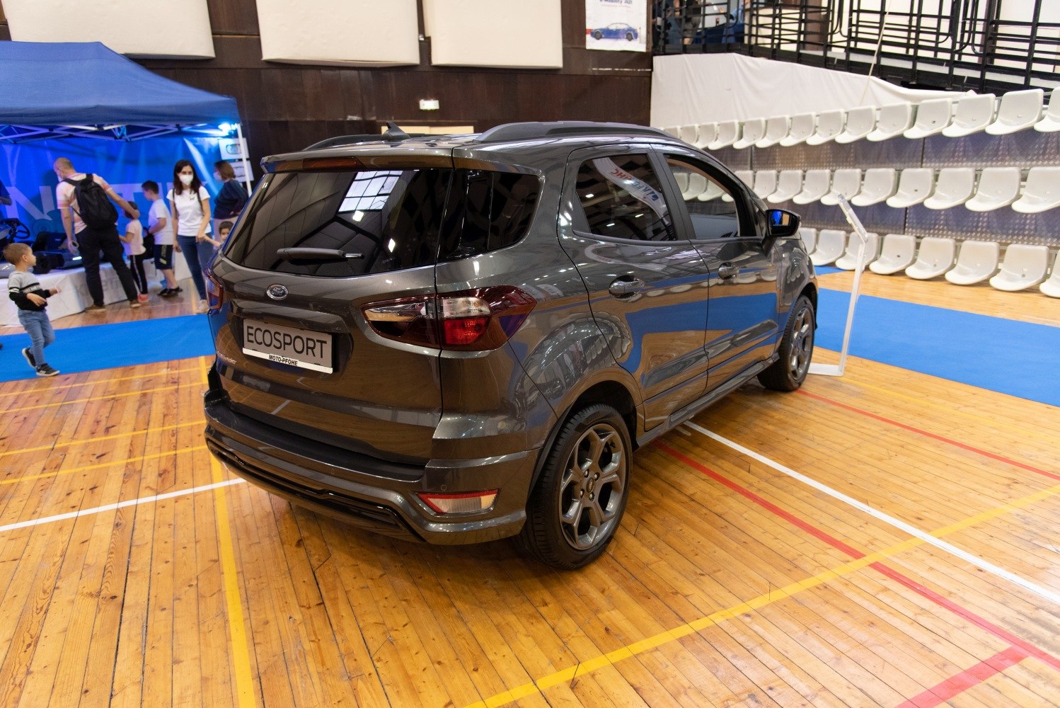 Rear side view of SUV with tinted windows and alloy wheels