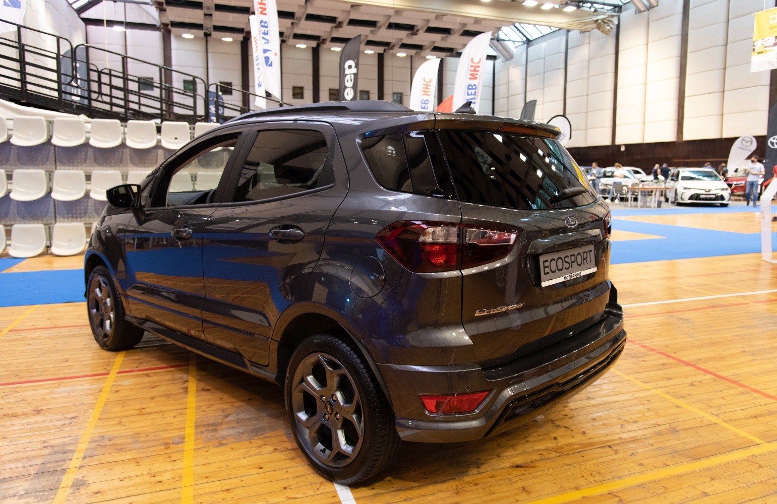 Rear side view with taillights and alloy wheels on compact SUV