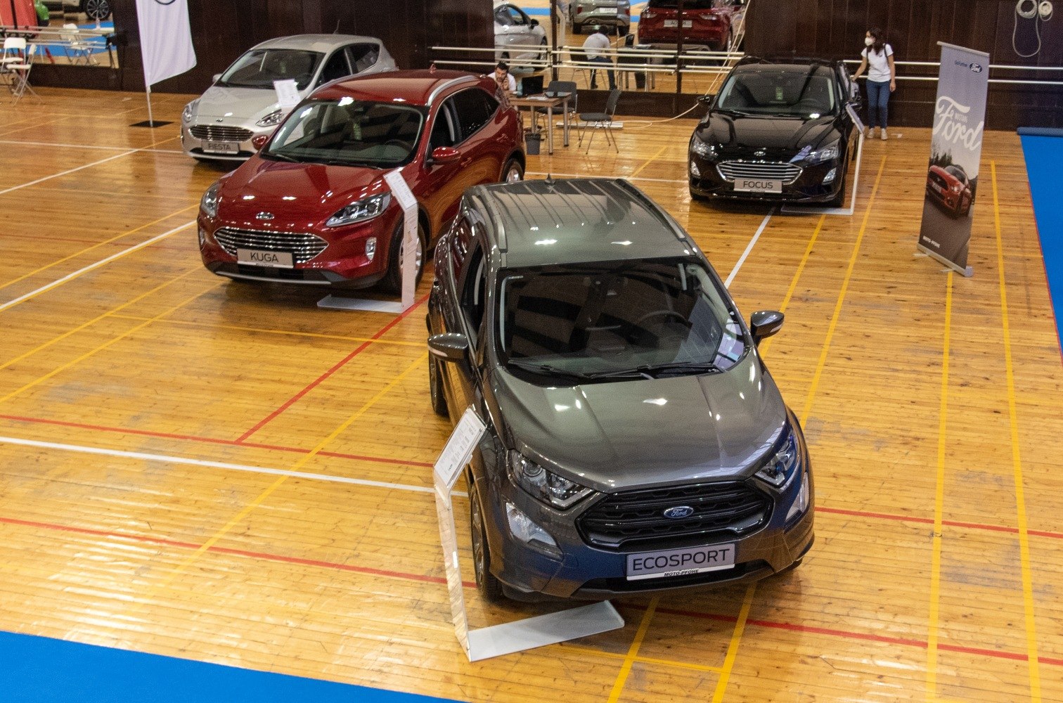 Front and interior view of SUV displayed indoors at auto show
