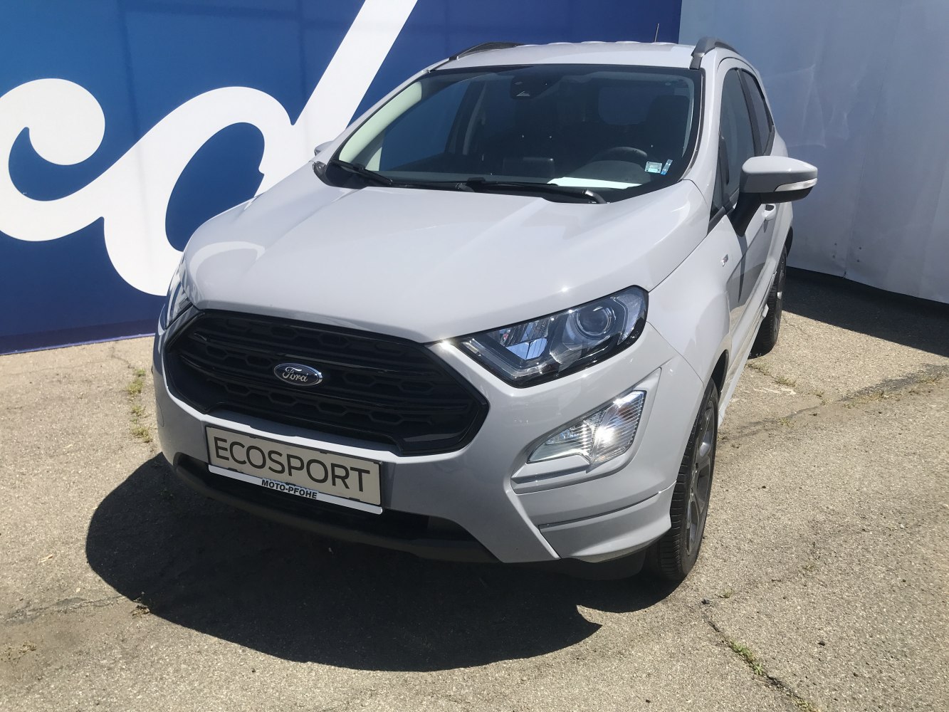Front view of compact SUV with bold black grille and sleek headlights