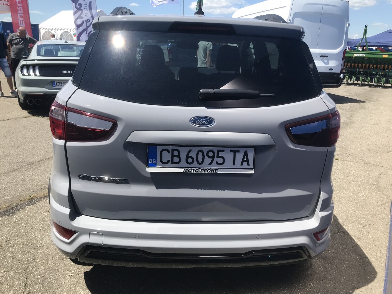 Rear view with taillights, rear window, bumper, and license plate