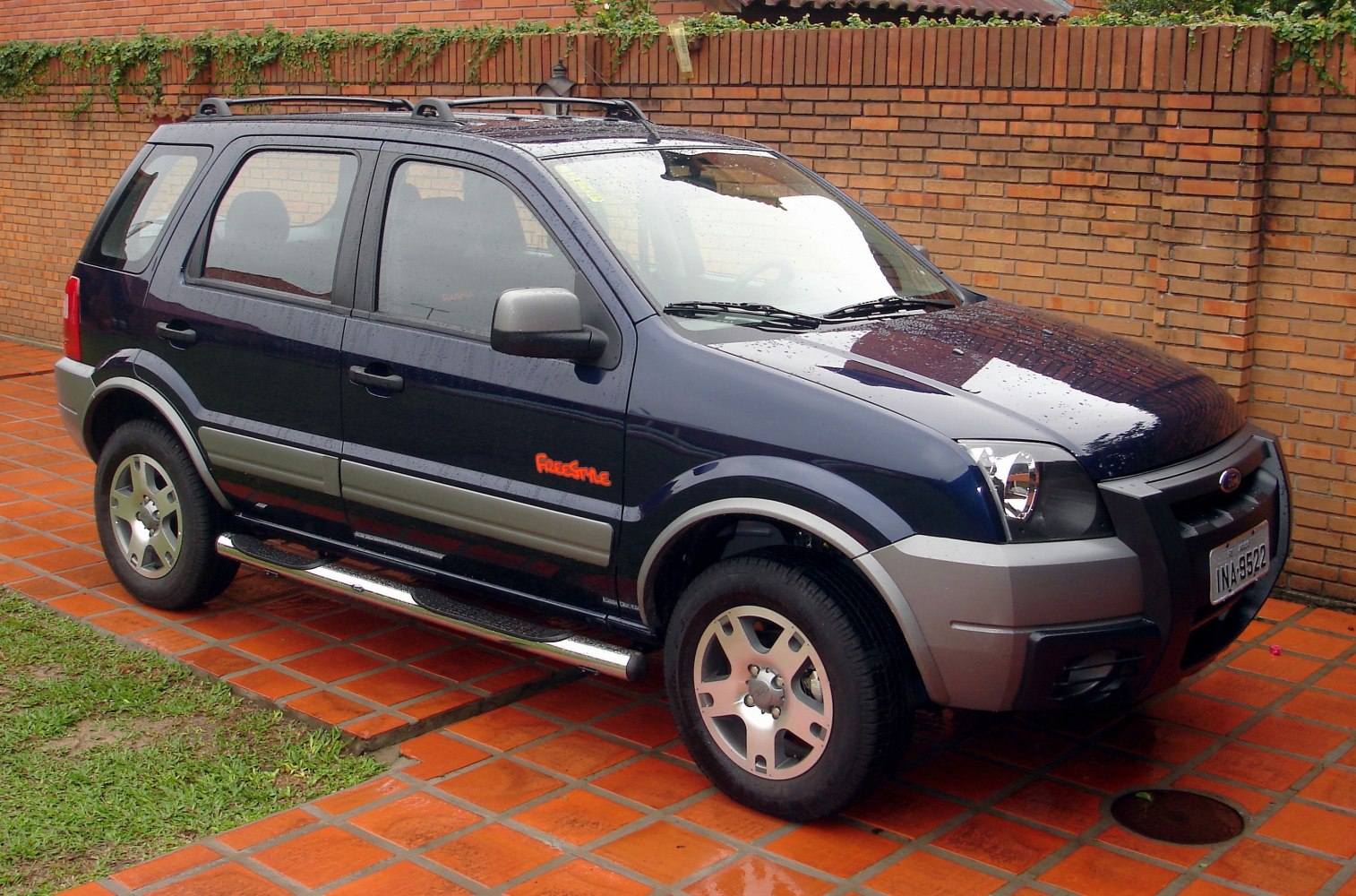 Two-tone SUV side profile with raised ride height and alloy wheels