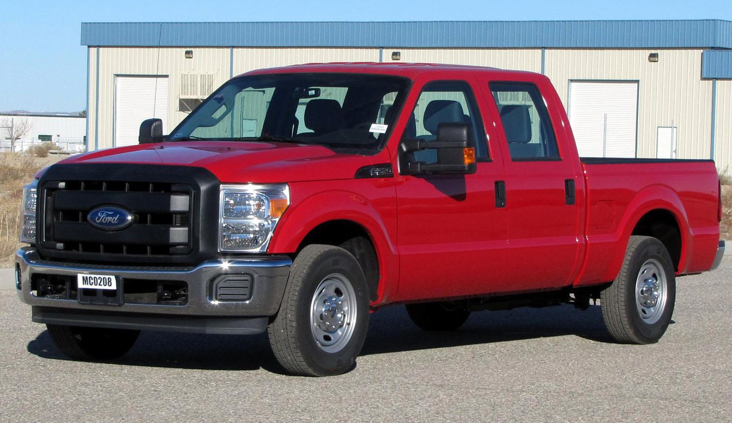 Red pickup truck with crew cab and short box in strong, durable design
