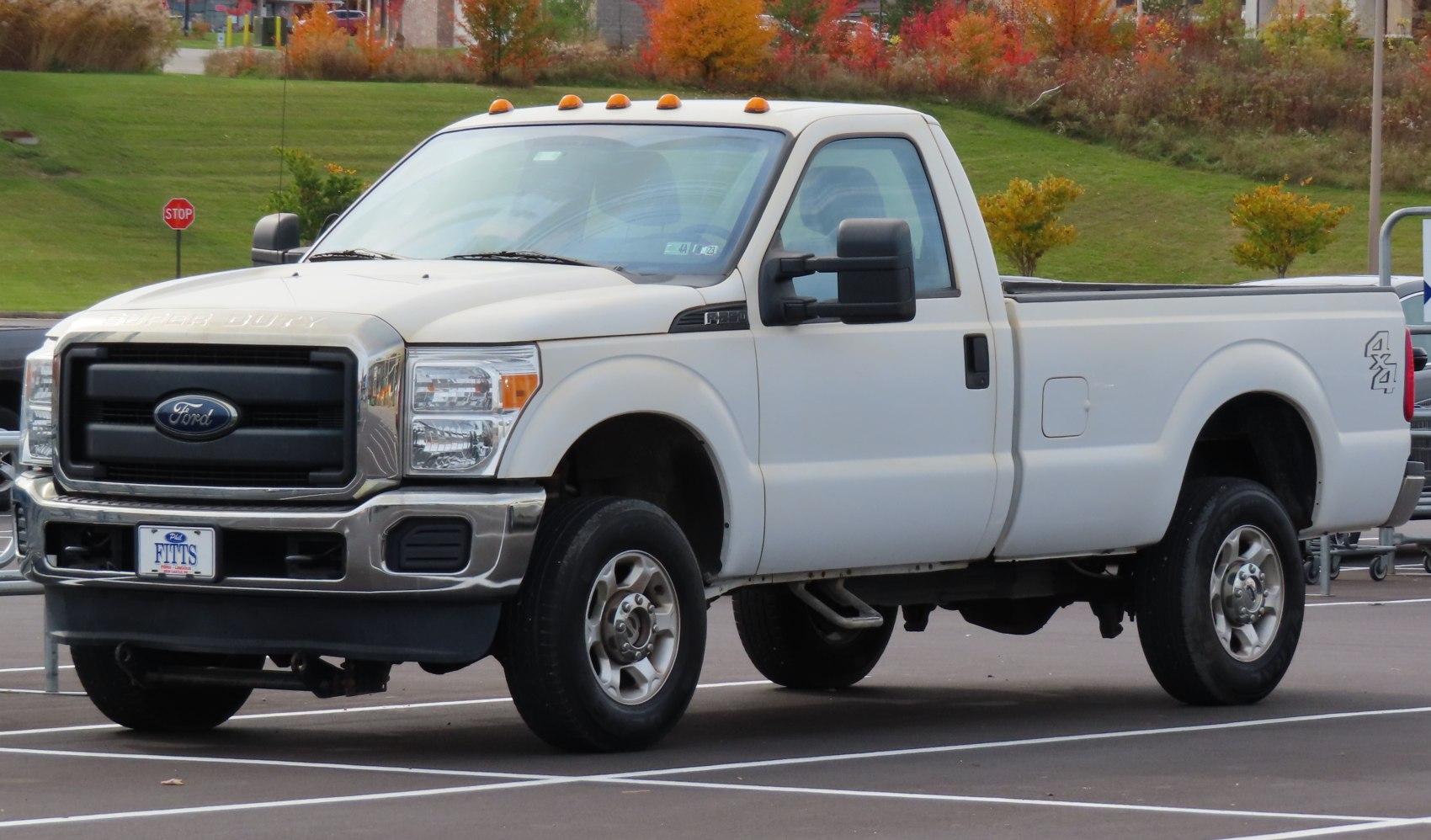 Regular cab pickup truck with long bed, 4x4 drive, and heavy-duty build