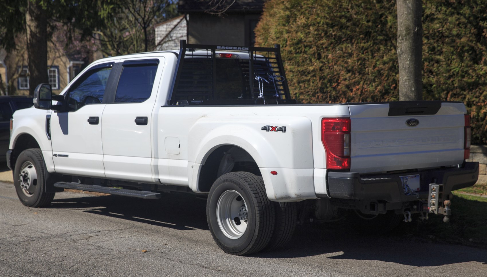 Rear side view of heavy duty pickup with dual rear wheels and crew cab.