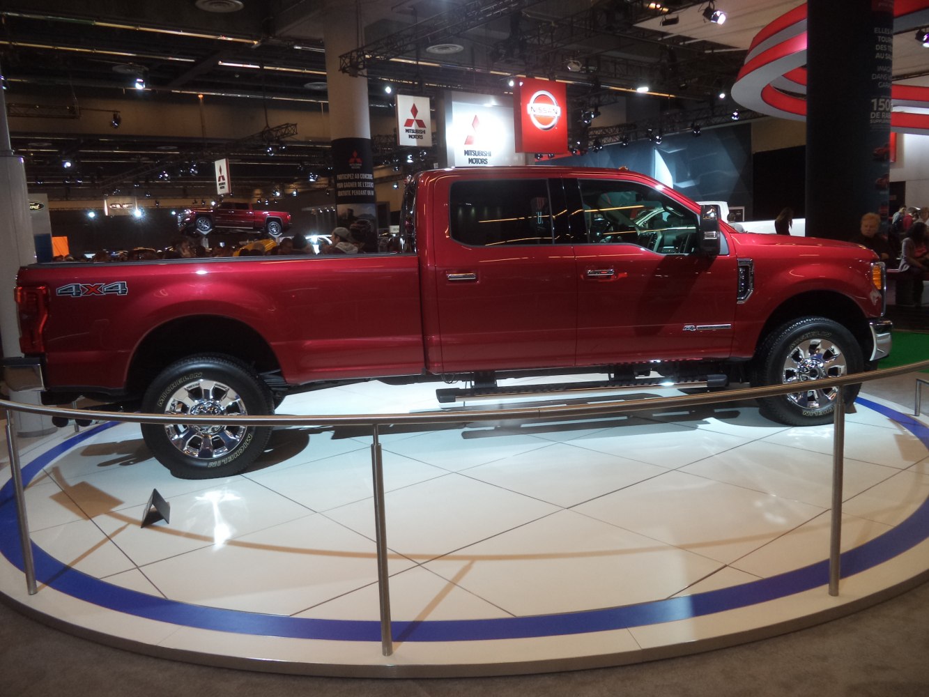Long crew cab pickup truck side view with 4x4 and chrome wheels