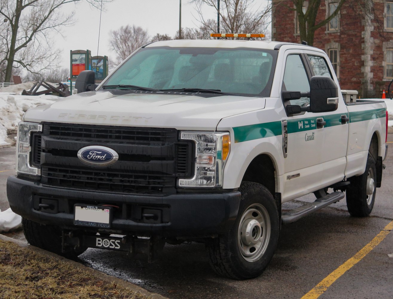 Heavy duty pickup with crew cab and long box, black grille