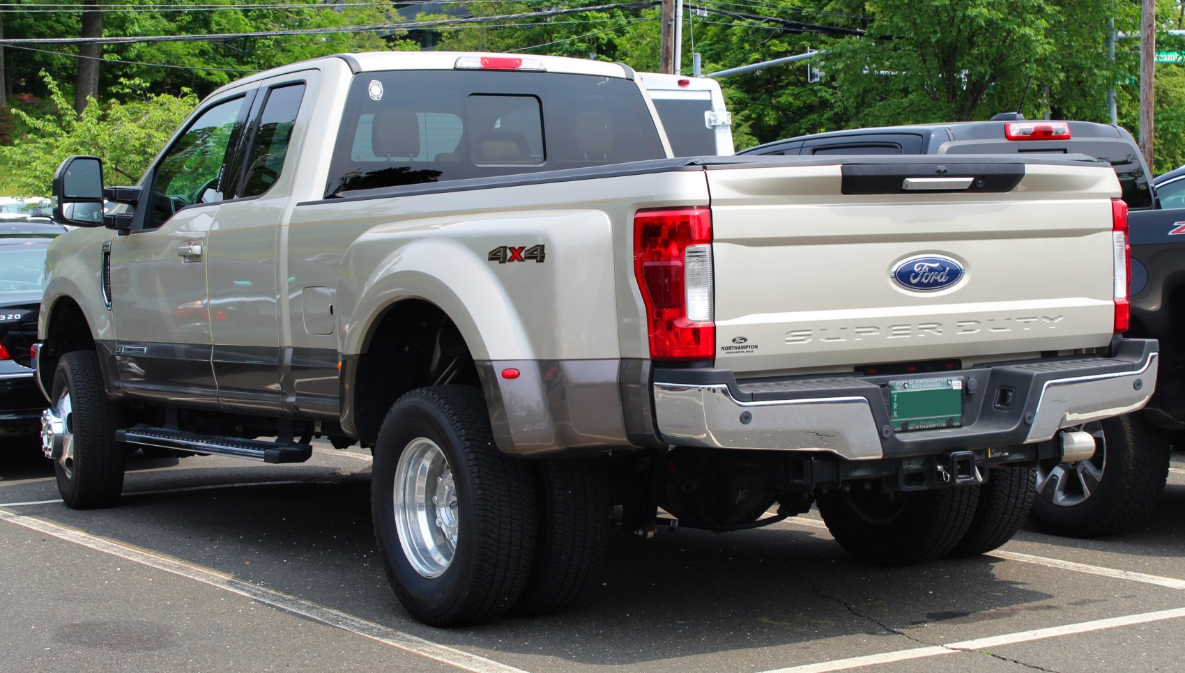 Rear side view of Super Cab long box with dual rear wheels and 4x4