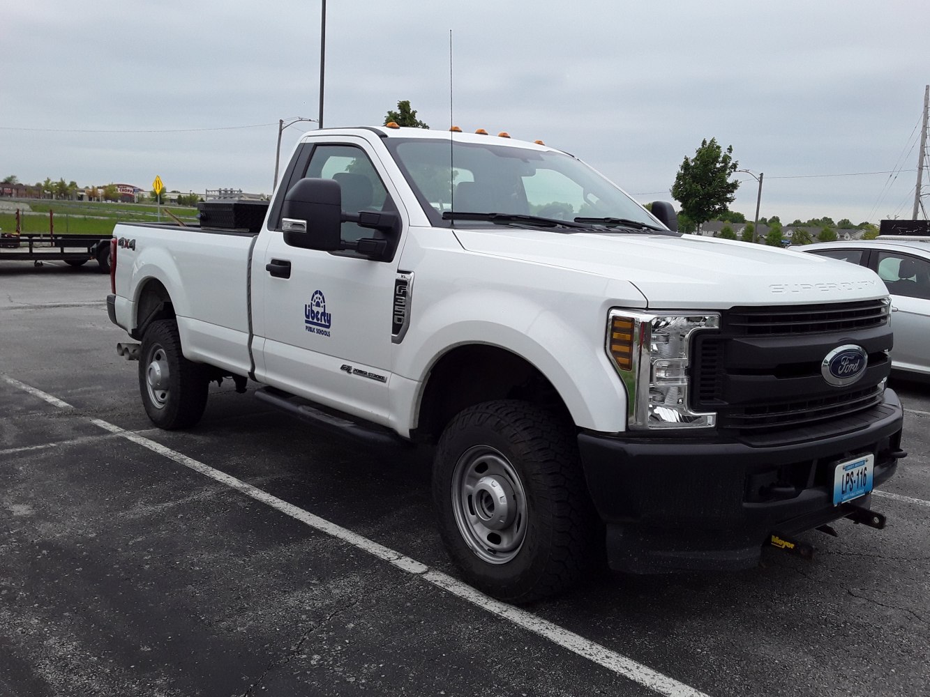Heavy-duty white pickup with regular cab and long box