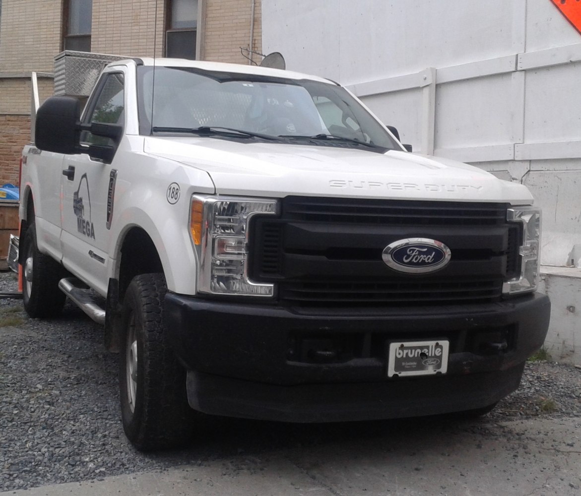 Front view of a regular cab long box pickup with distinctive grille and headlights
