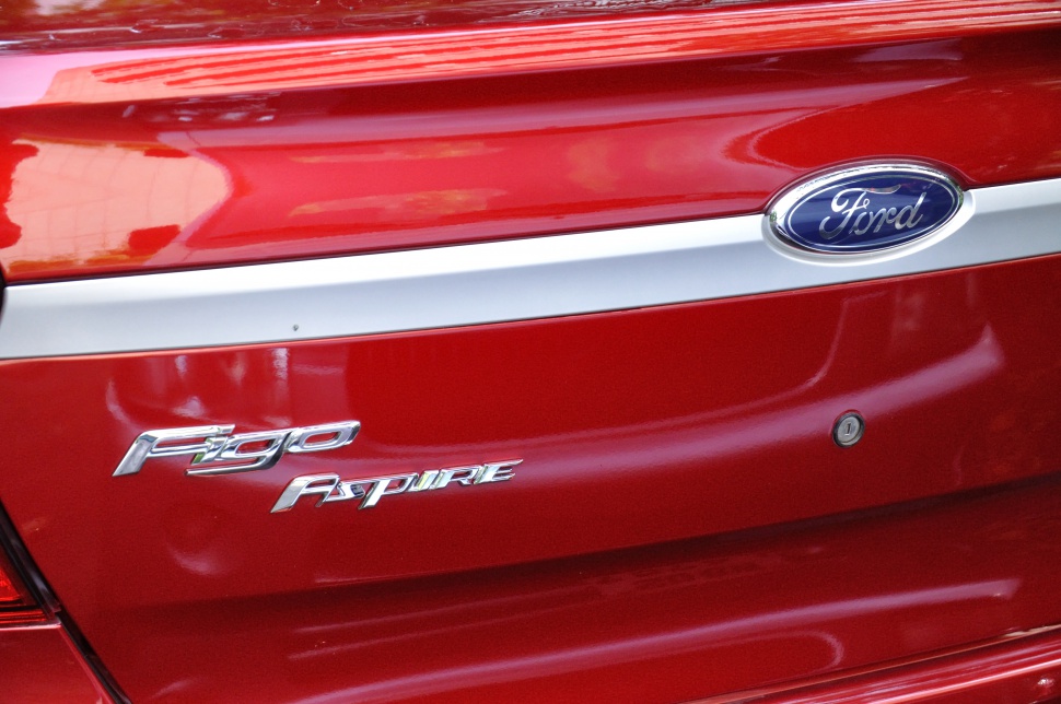 Close-up of red car rear with Ford and Figo Aspire badges