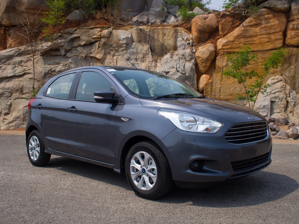 Front-side view of compact hatchback with sleek design and alloy wheels