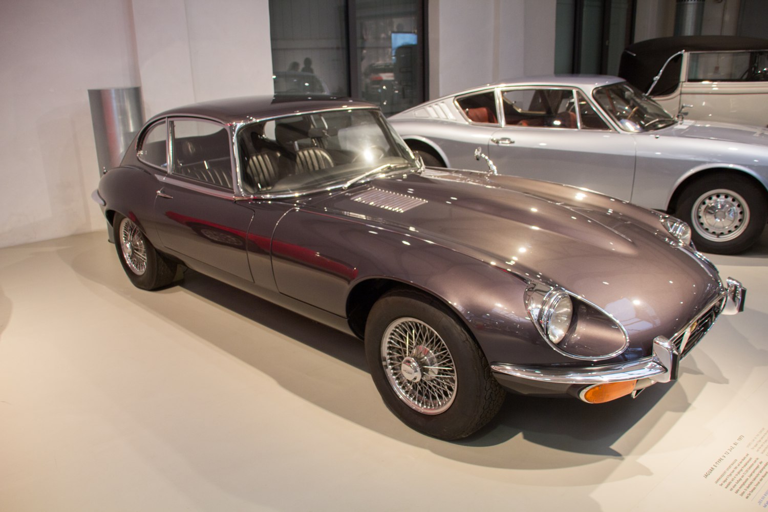 Luxury coupe with wire spoke wheels and sleek aerodynamic body