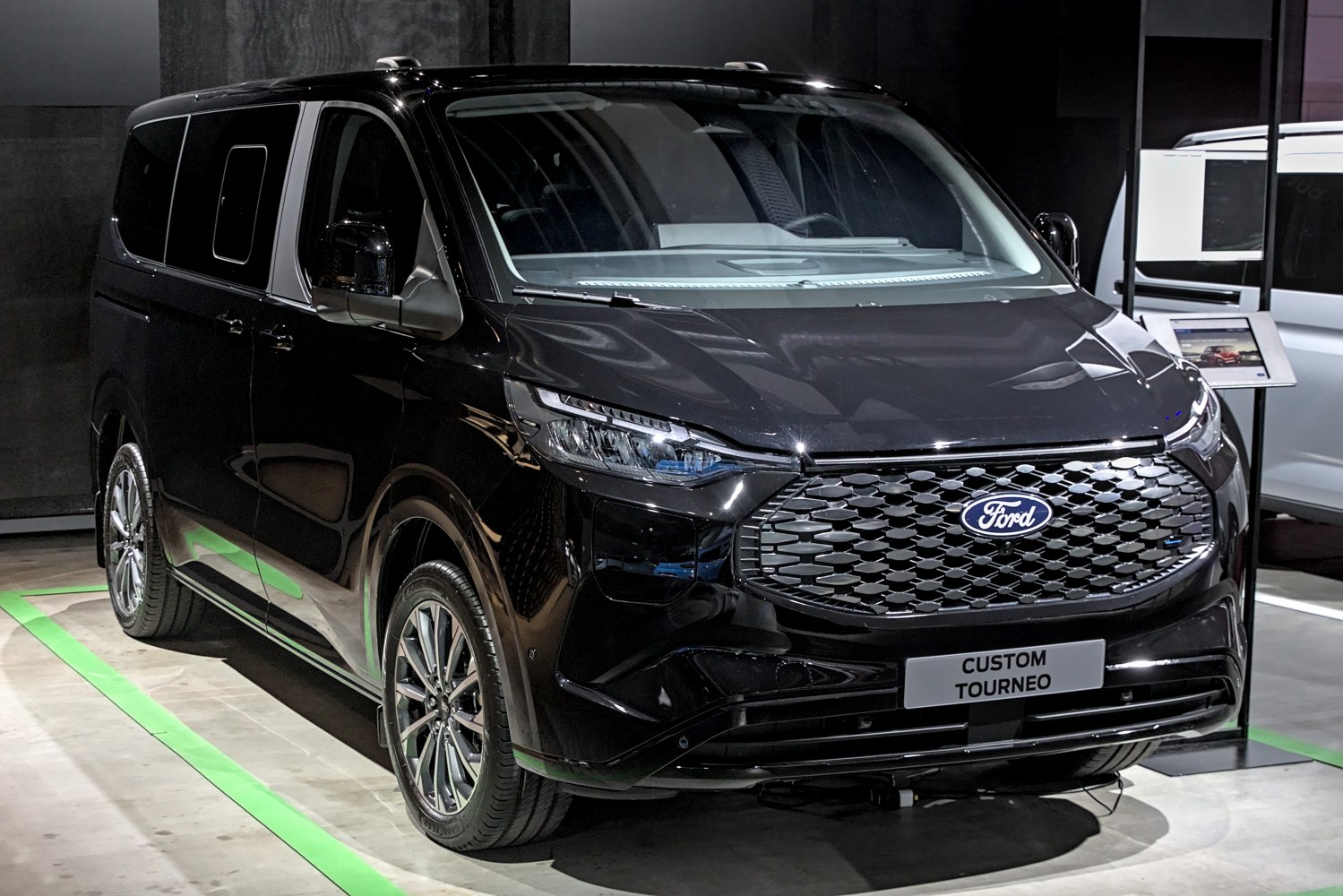 Modern van front with bold grille and sleek headlight design