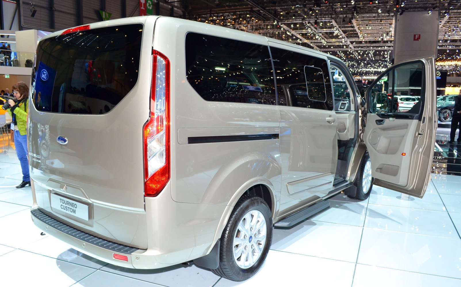 Rear and side view with open passenger door and vertical taillights