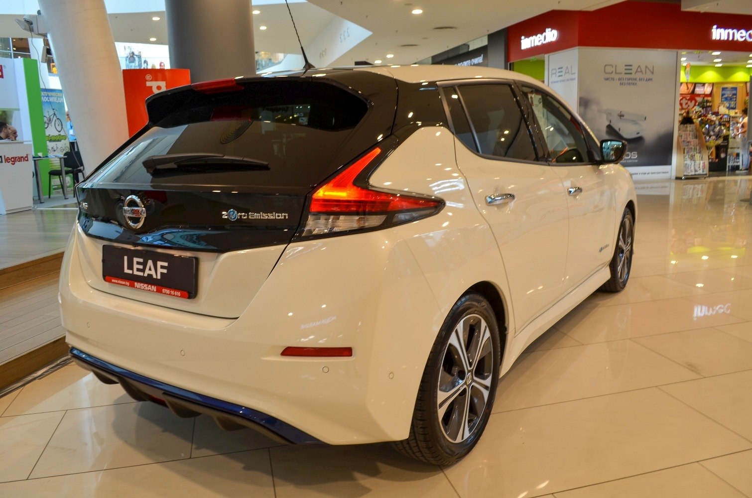 Rear view of hatchback with distinctive taillights and zero emission badge