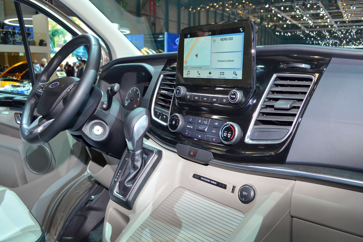 Modern vehicle interior with touchscreen infotainment and automatic gear shift