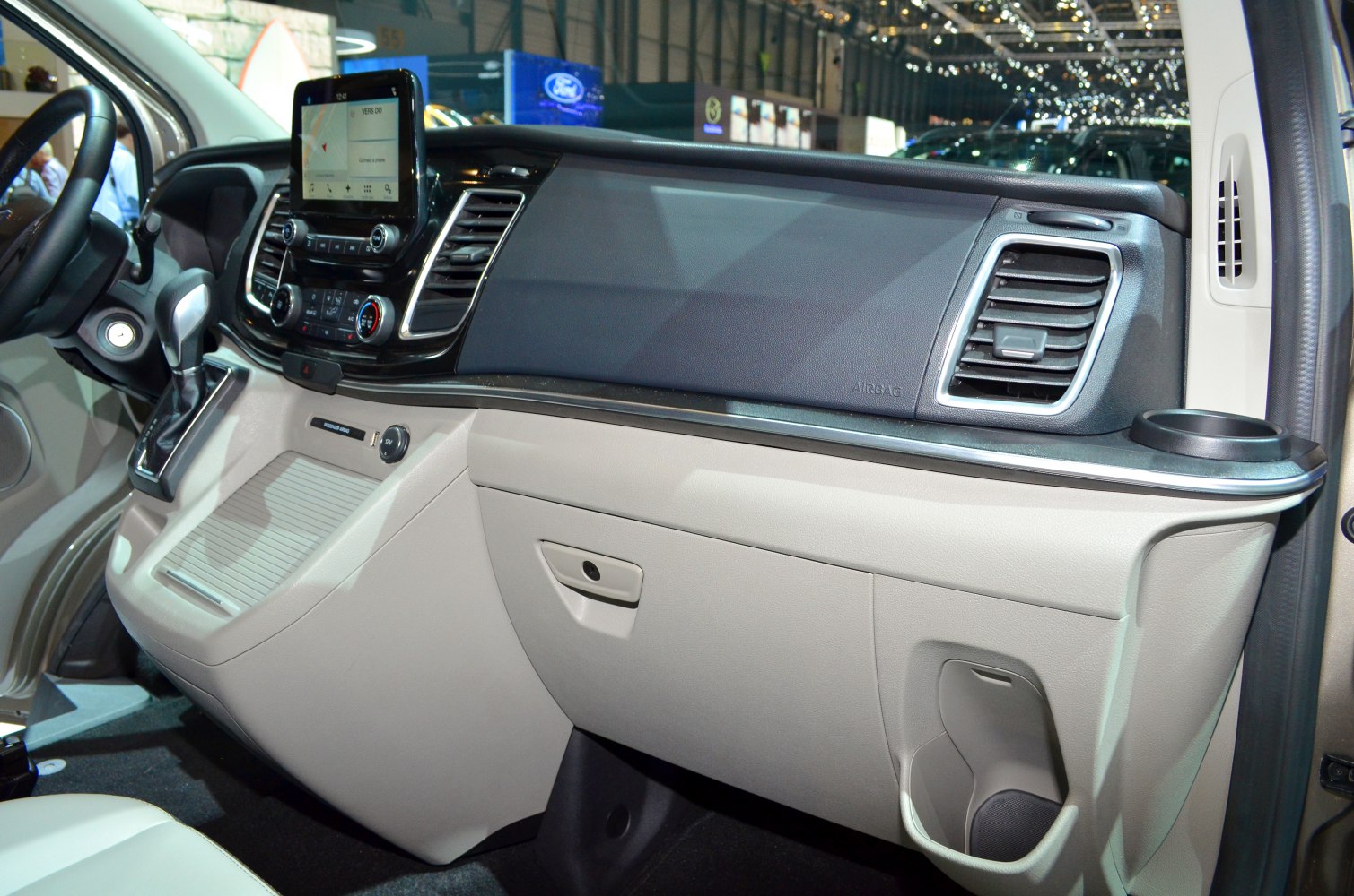Dashboard and infotainment system with control panel and air vents