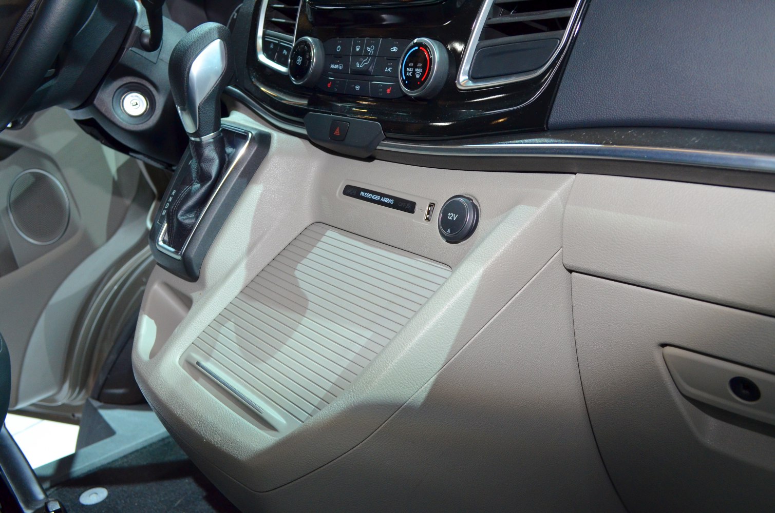 Dashboard with gear shifter, control panel, and 12V socket