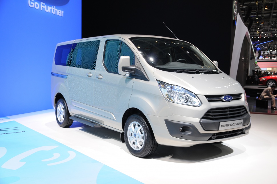 Front and side profile of a passenger van with sliding door