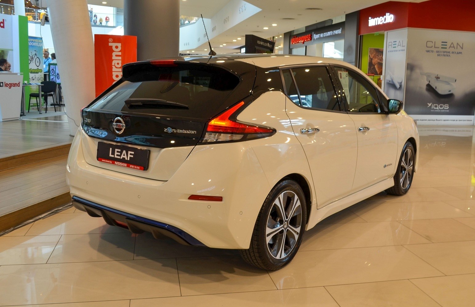 Rear view of an electric hatchback with zero emission badge and aerodynamic design