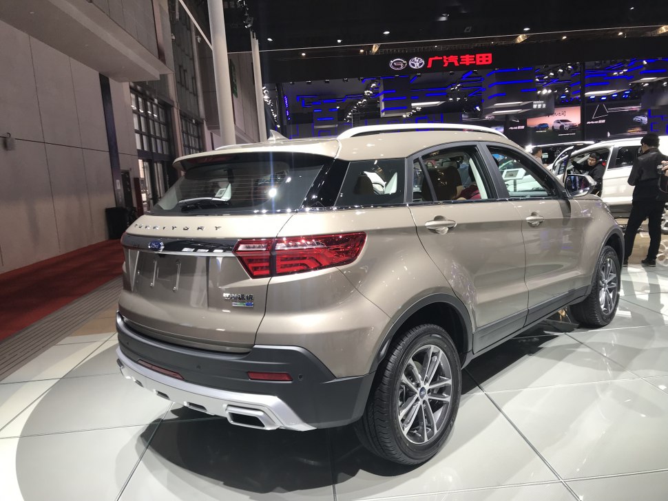 Rear and side exterior view of SUV with distinct tail lights and dual exhausts