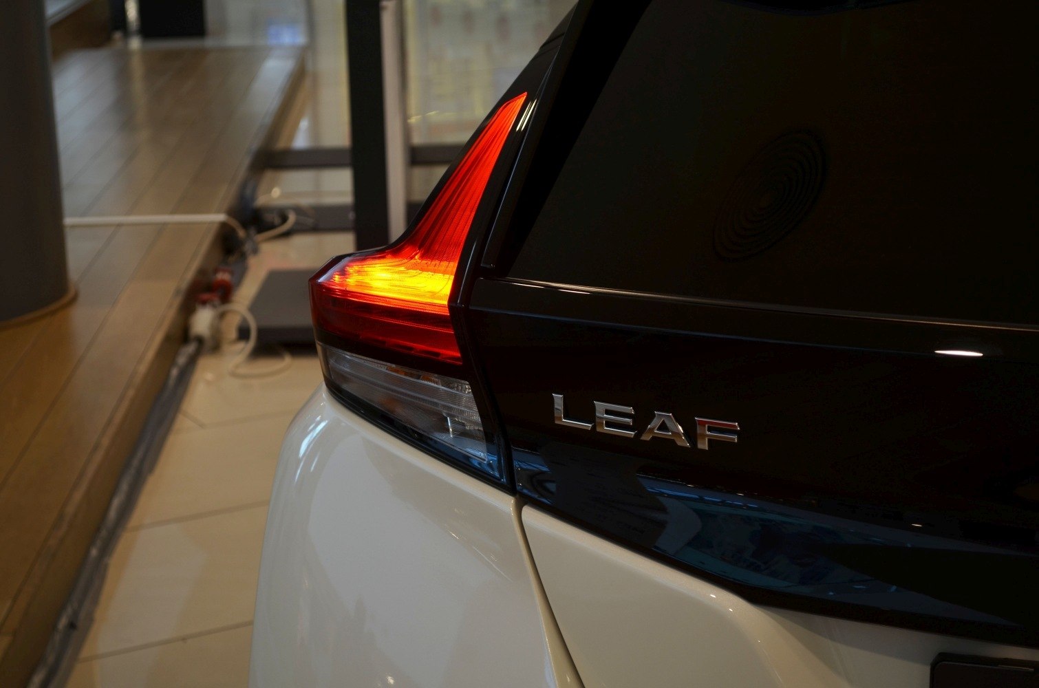 LED tail light with rear model badge on a modern electric vehicle.