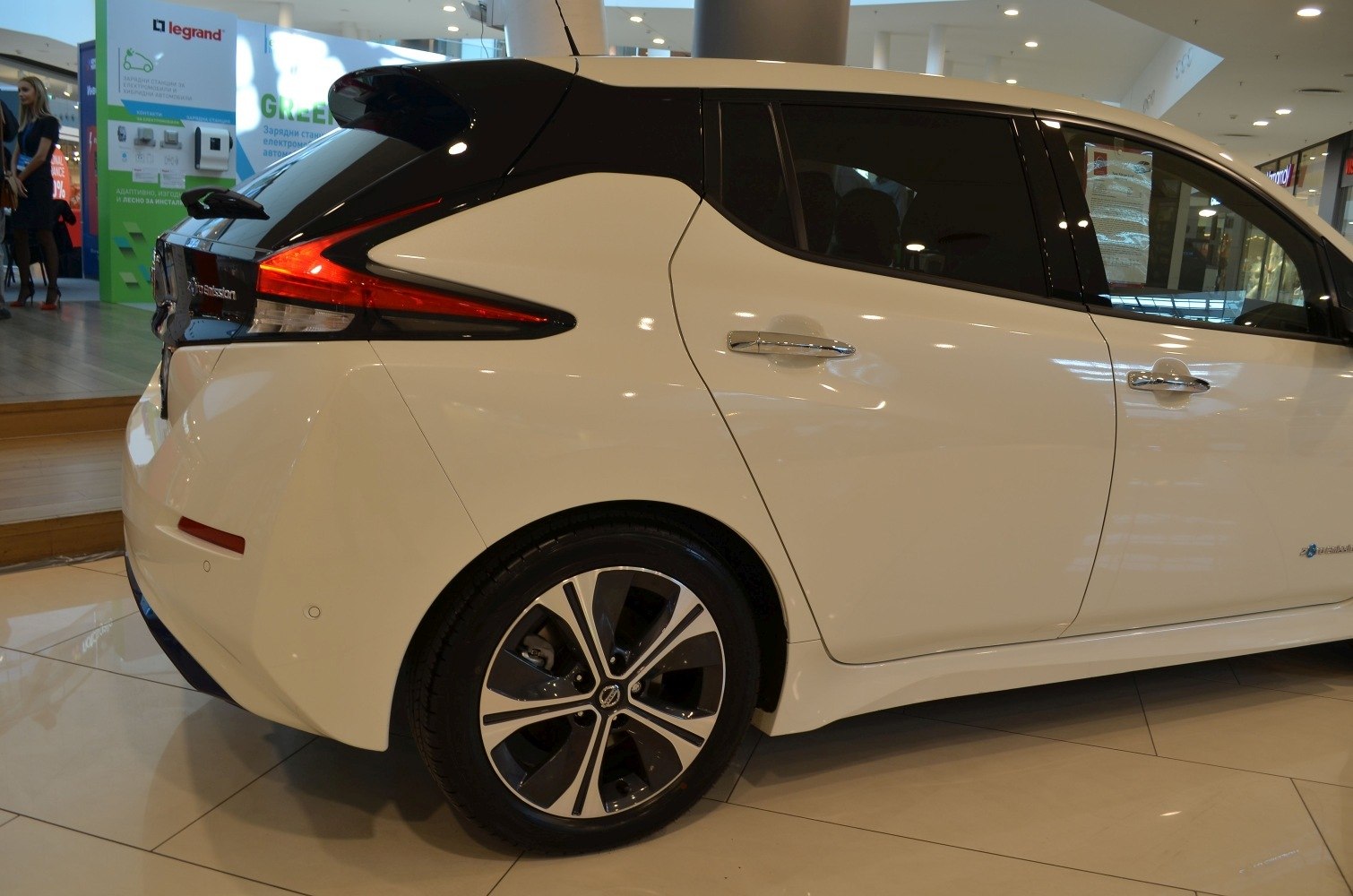 Rear and side profile with distinctive tail lights and alloy wheels