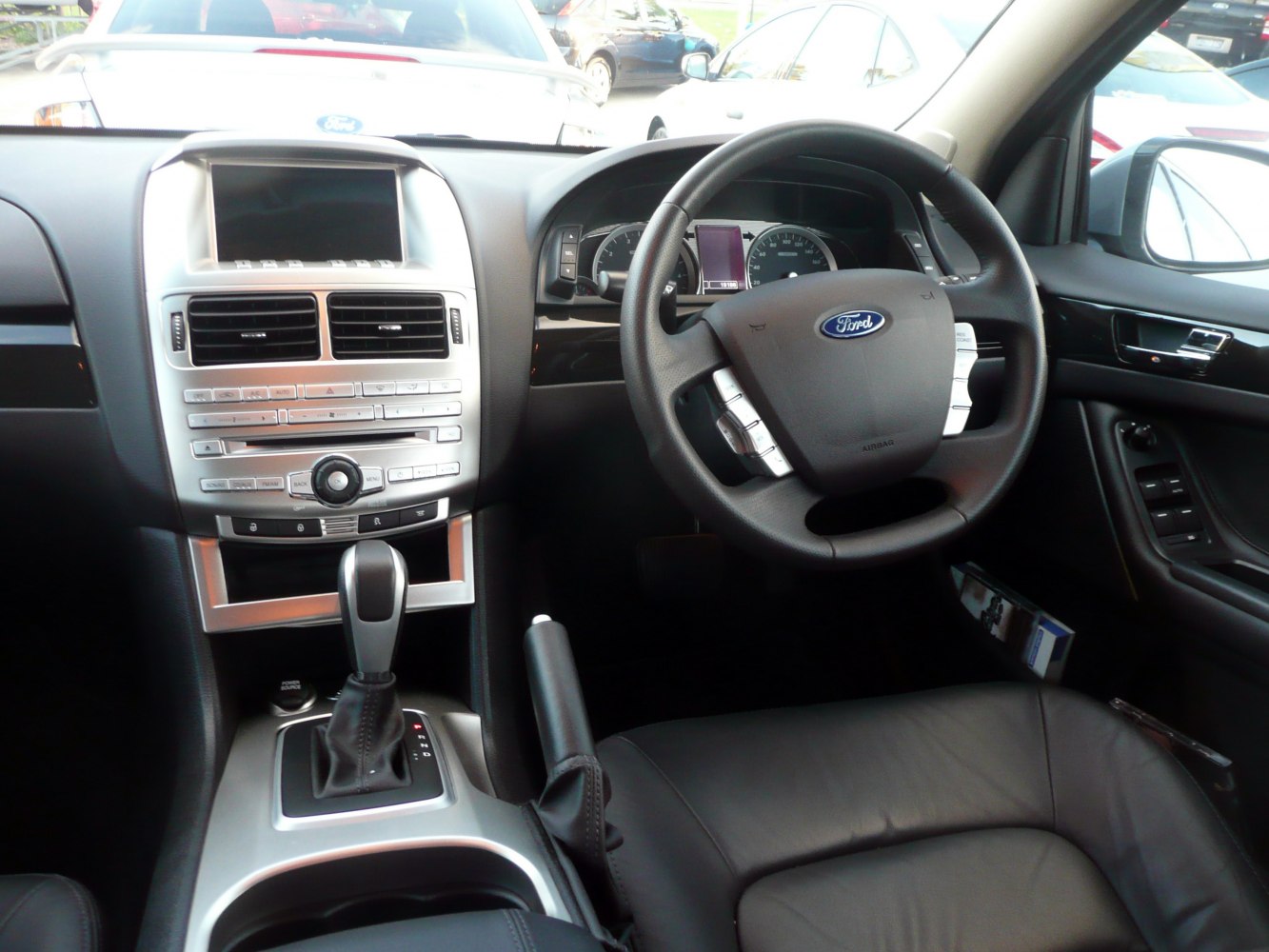 Interior dashboard and steering wheel with center console and automatic gear shift